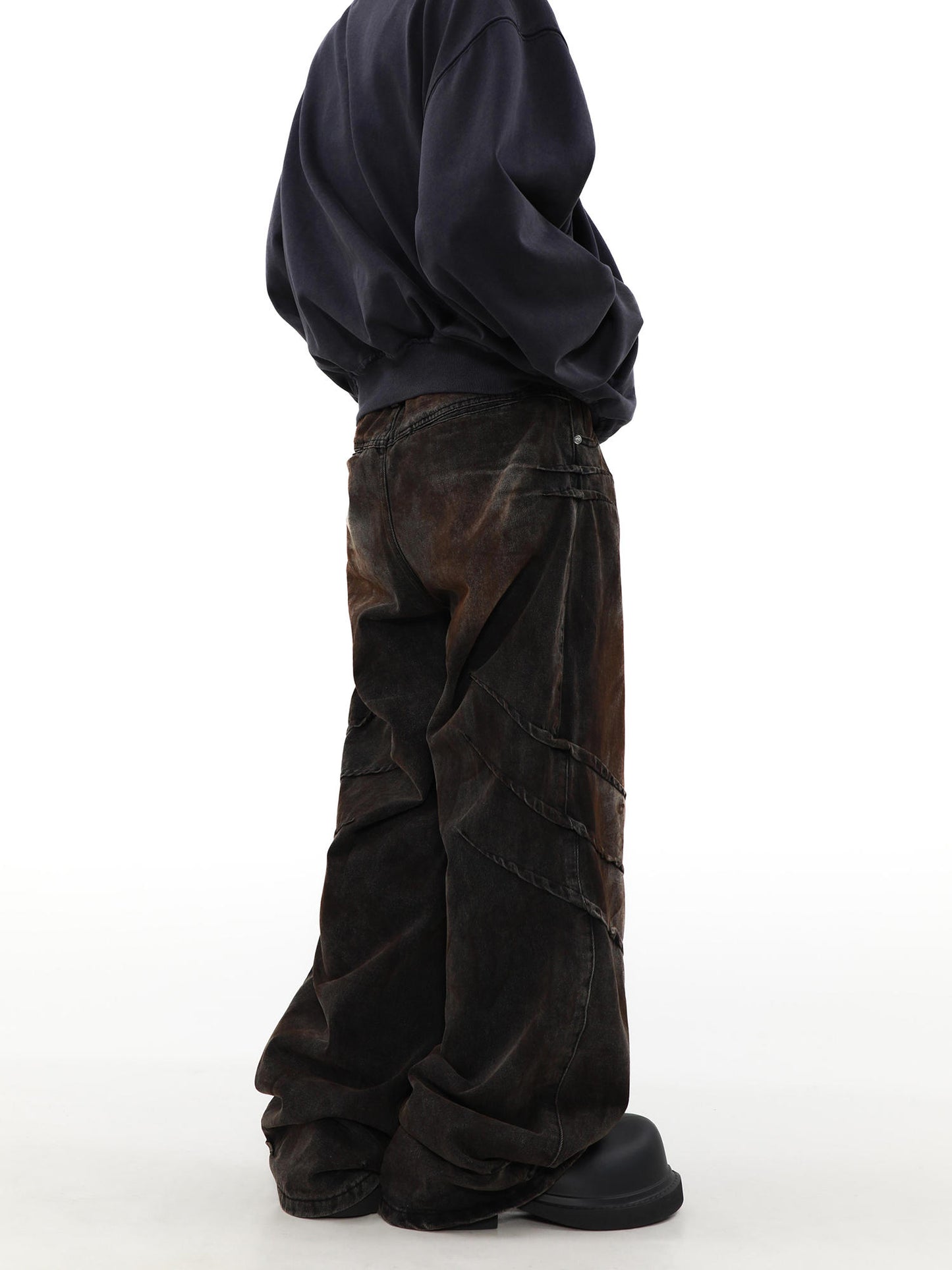 Distressed and dirty waste jeans